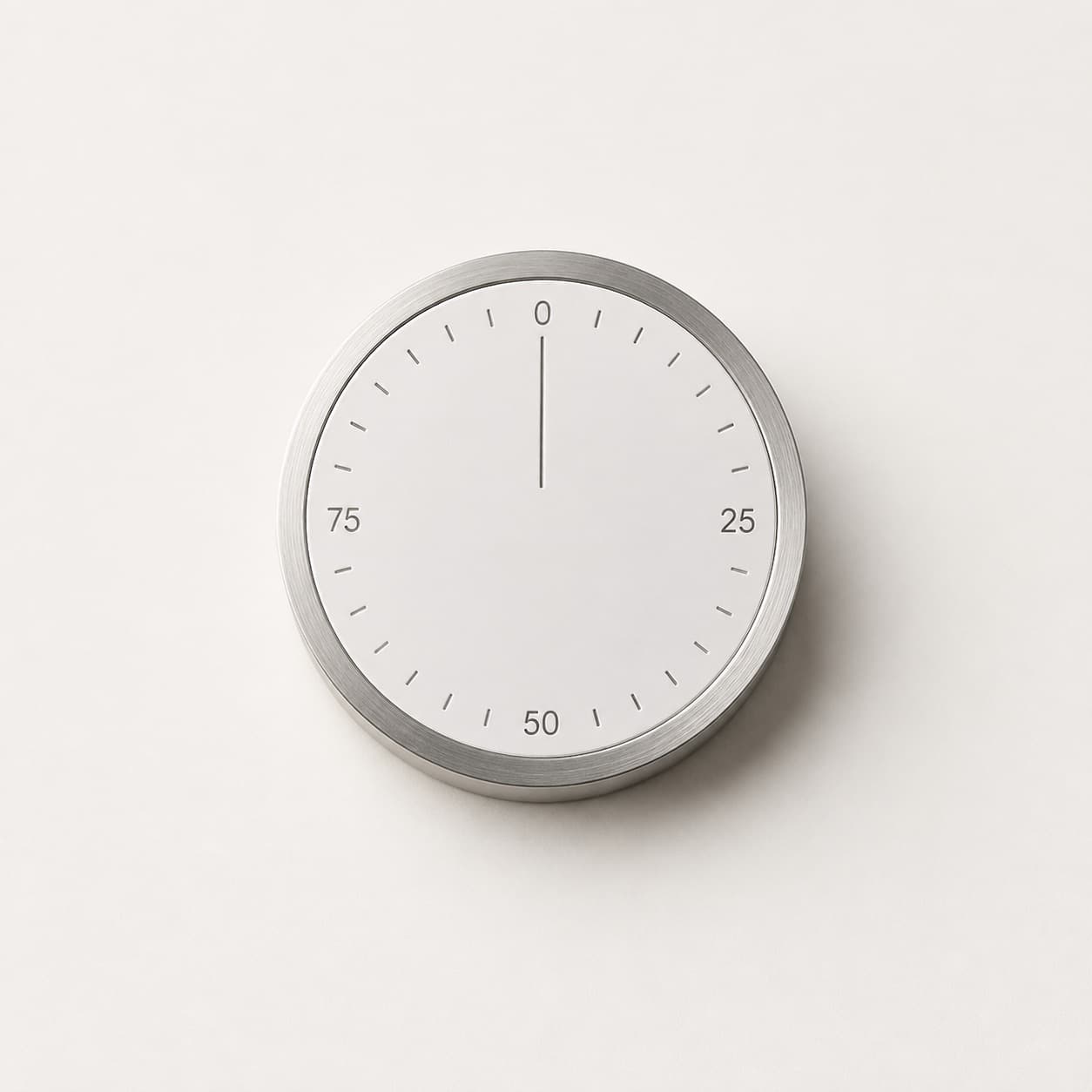 Round precision dial with an engraved scale from 0 to 75, needle resting at zero